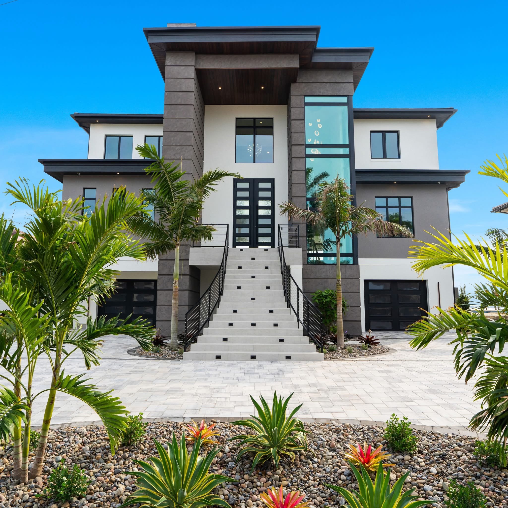 Hand-forged custom iron entry doors in a Southwest Florida home