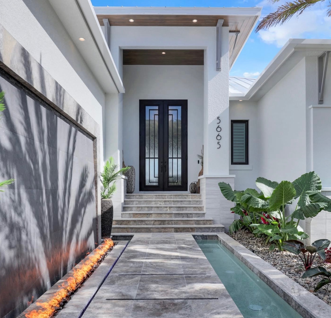 Custom hand-forged iron entry with glass