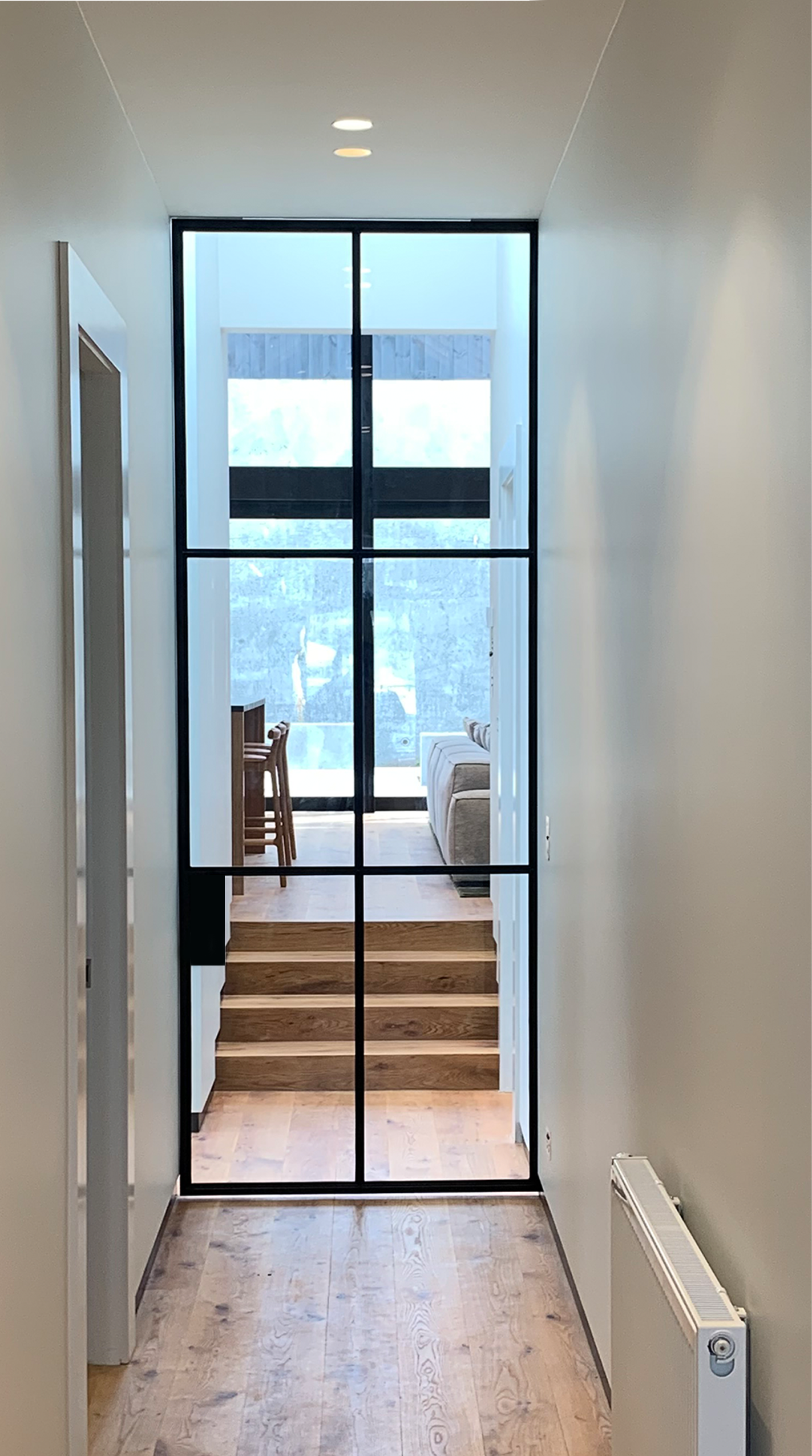 Ignition Series glass door framing a hallway