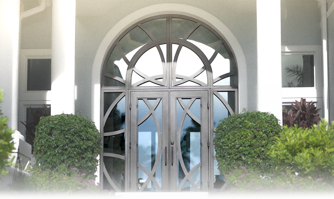 Custom elliptical iron-and-glass entry doors on a Southwest Florida home