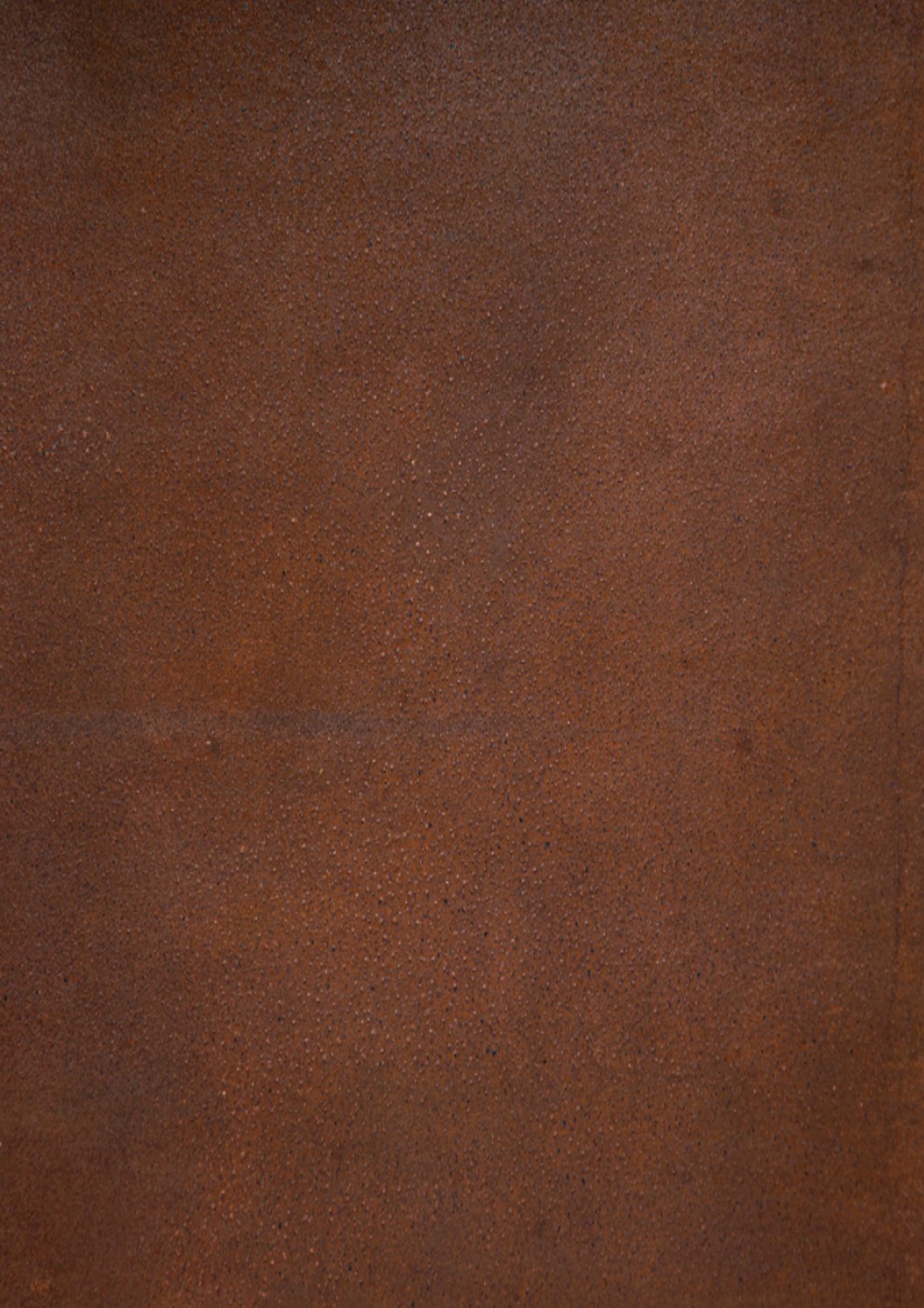 Weathered Corten steel surface with warm rust patina